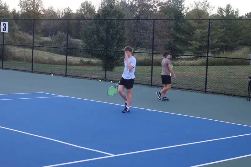 Players moving between drills on court