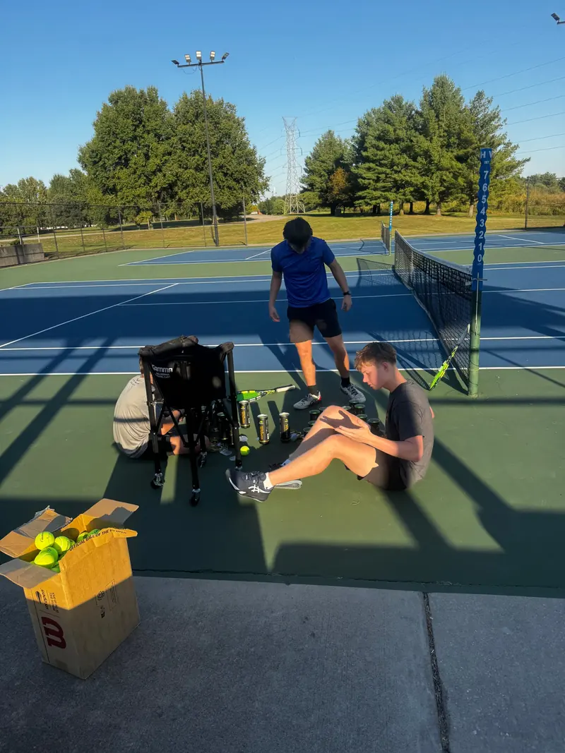 Players setting up new balls before a training session